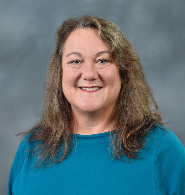 a studio profile photo of liz hinkle staff member